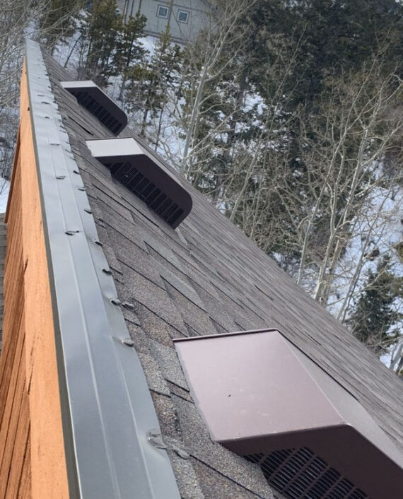 Engineered for mountain living. This high-altitude, steep-slope project utilizes advanced ventilation box vents and reinforced metal drip edges to prevent ice damming during heavy Colorado winter snows.